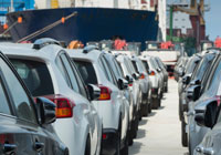 cars in a line at a dock