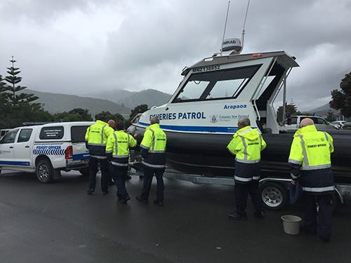 MPI fishery officers and honorary fishery officers helping with the blessing of the Arapaoa