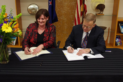 Carol Barnao and Michael R. Taylor signing the agreement