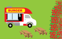 food van selling burgers standing on grass near 2 picnic tables with benches