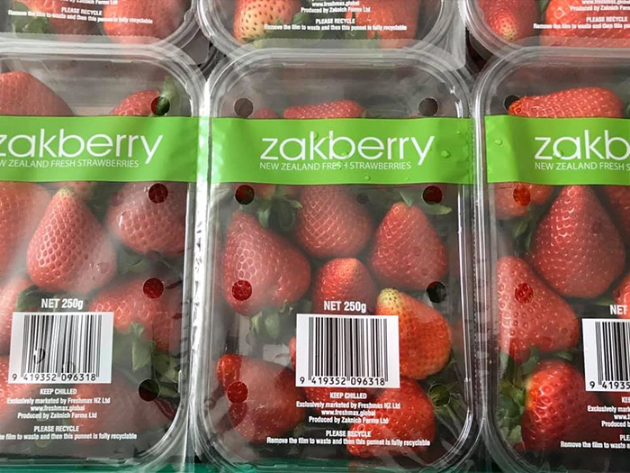 Punnets of strawberries with Zakberry branding