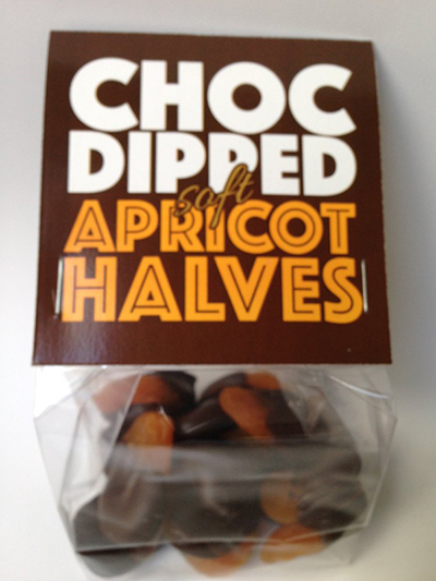 Image of choc dipped soft apricot halves in plastic bag
