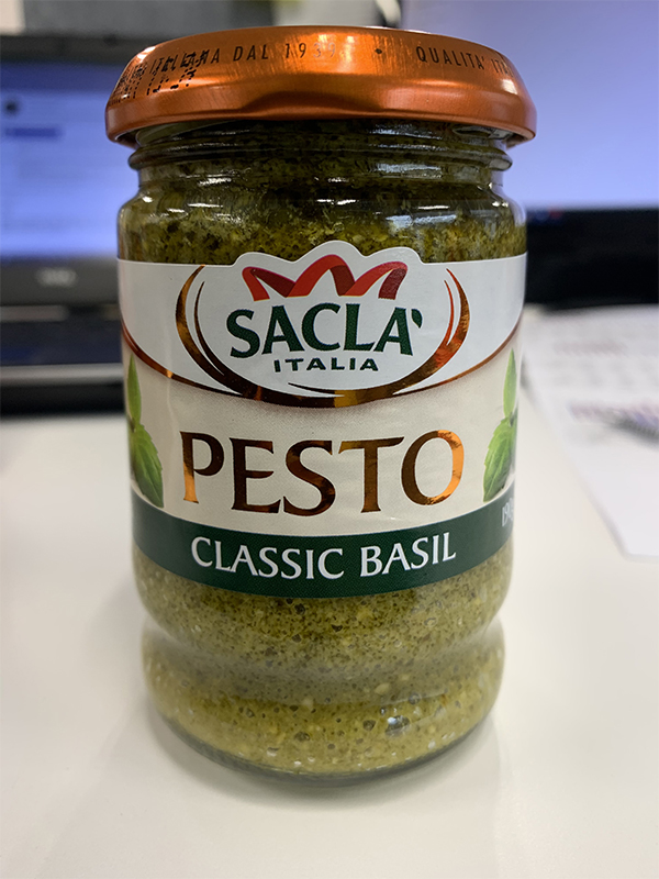 Photo of Sacla’ Italia brand Classic Basil Pesto in a glass jar.