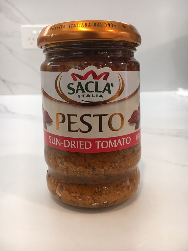 Photo of Sacla' Italia  brand Sun-dried Tomato Pesto in a glass jar.