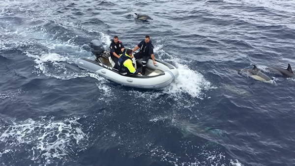 Fisheries officers in an inflatable