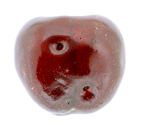 Cherry with sunken holes on surface